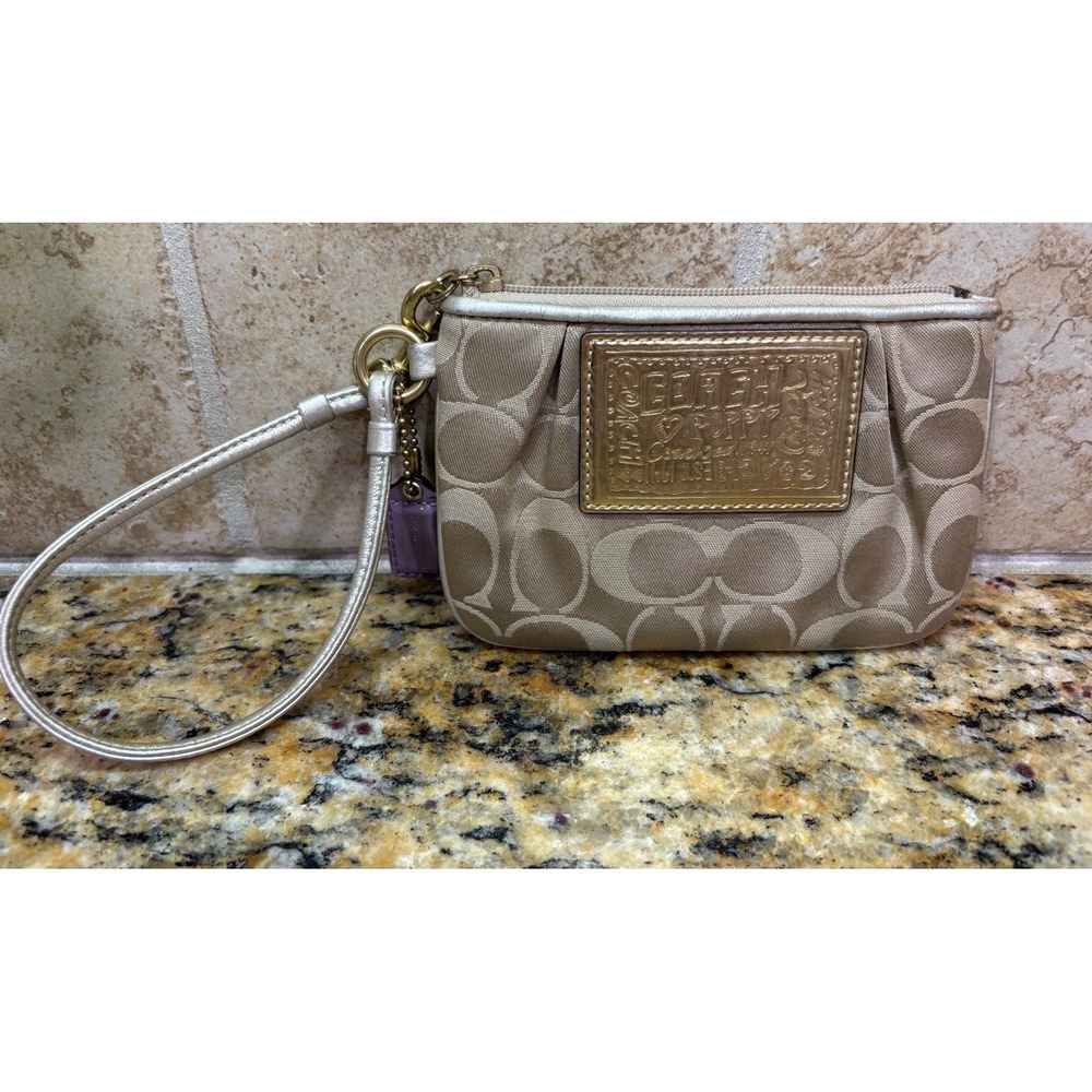 Coach Beige Logo Wristlet with Gold-Tone Plaque, Metallic Leather Strap